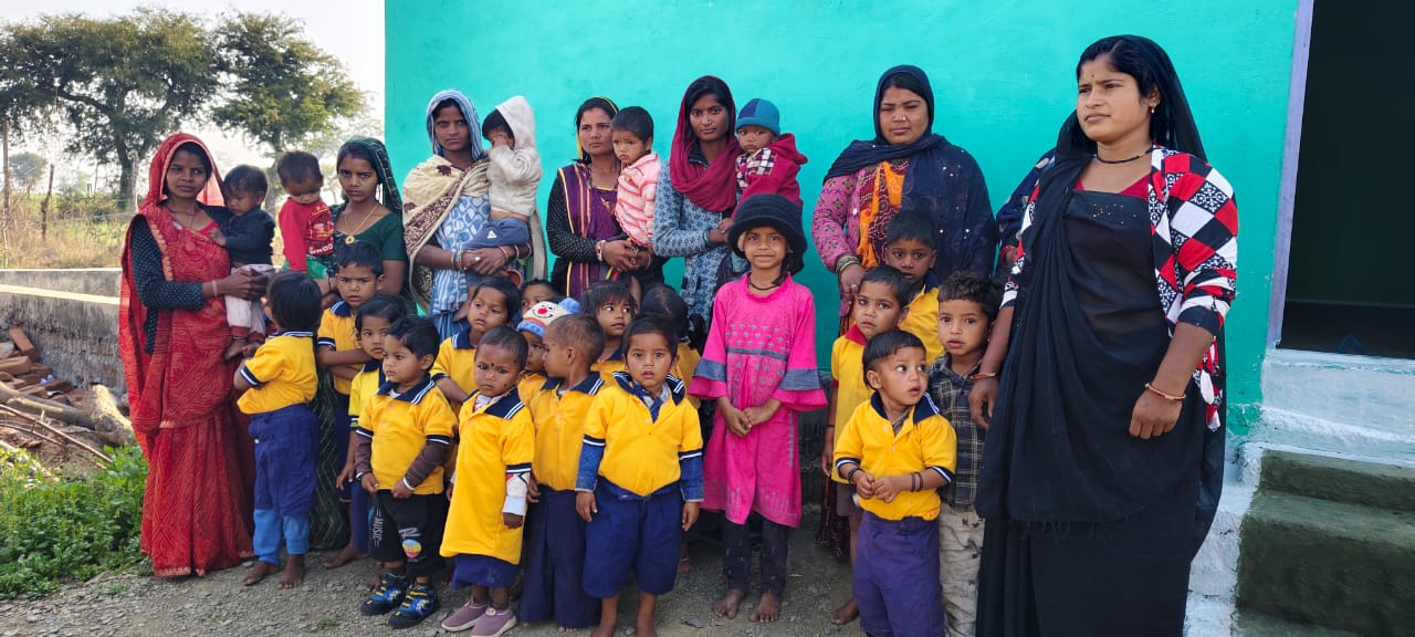 Rural mothers and children gathered at a village anganwadi